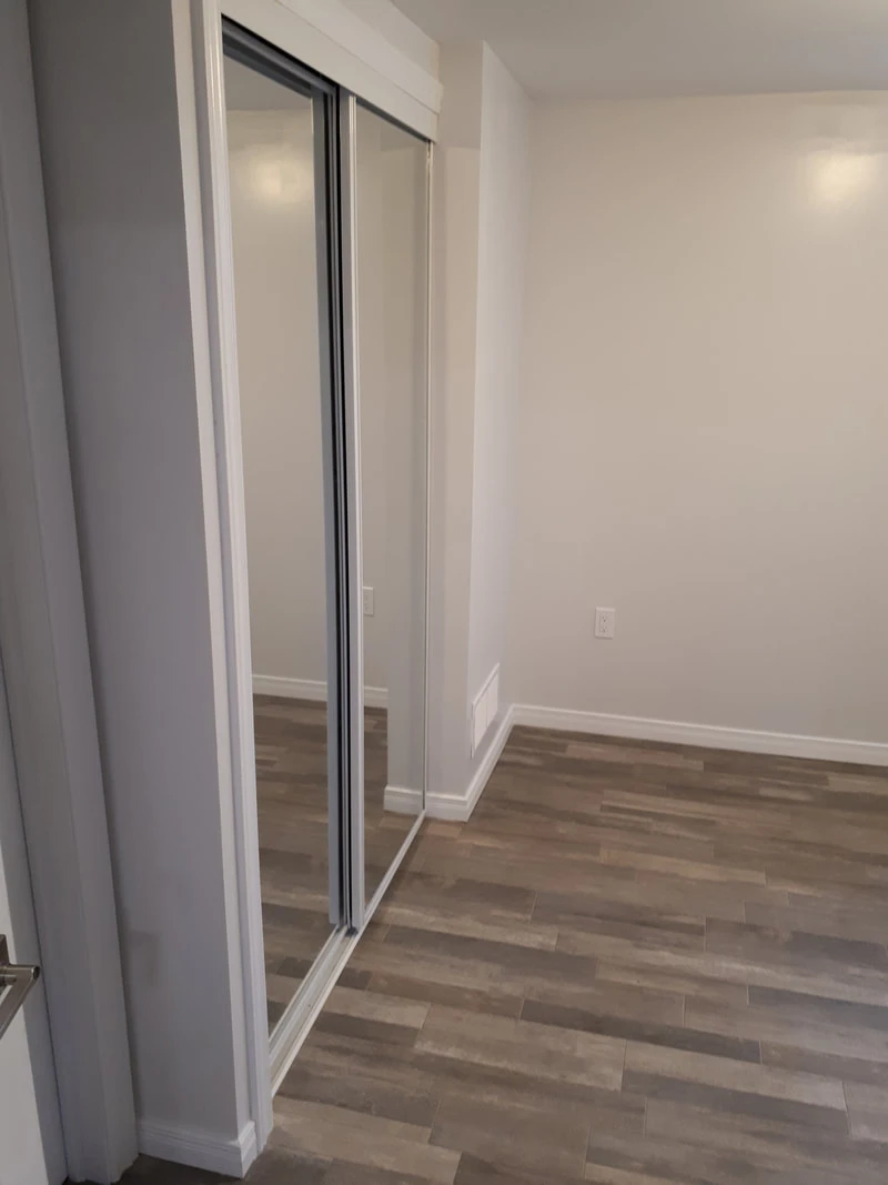 Custom Closet (Mirrored Sliding Drs.)