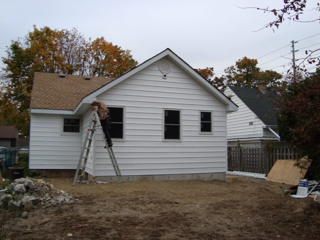 Home addition in progress showing a skilled tradesman during the renovation process in a residential property in London, Ontario