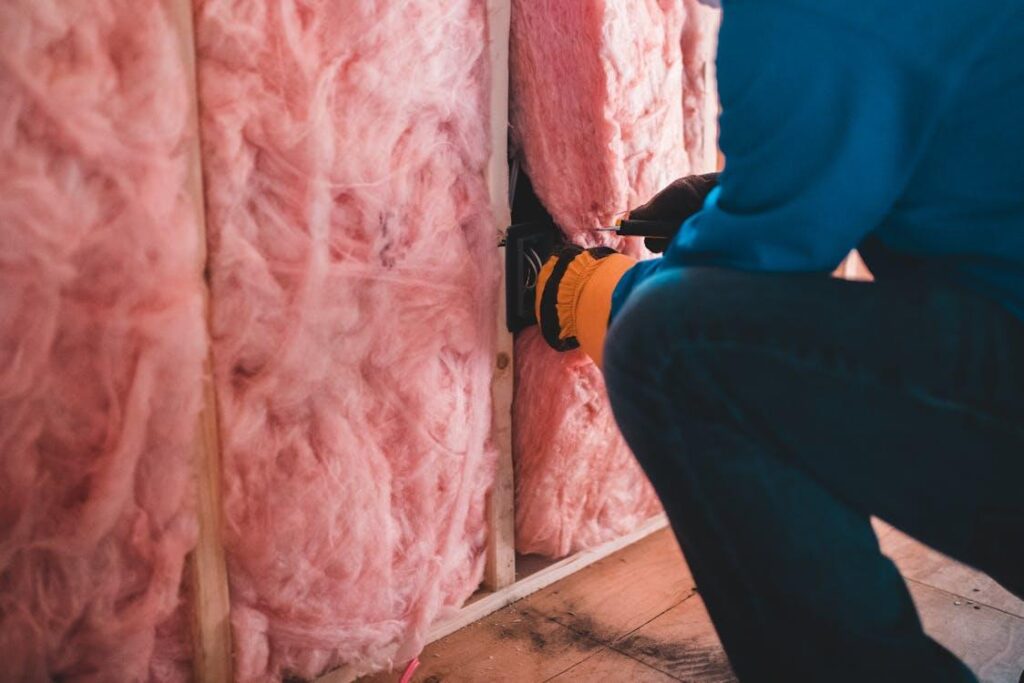 Workers installing insulation